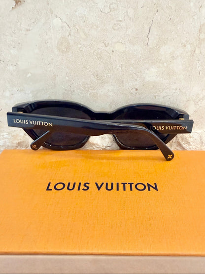 Louis Vuitton sunglasses on a Louis Vuitton box with a light gray background